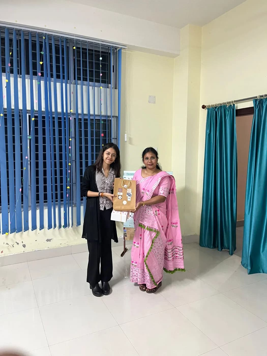 A winner receiving a gift hamper